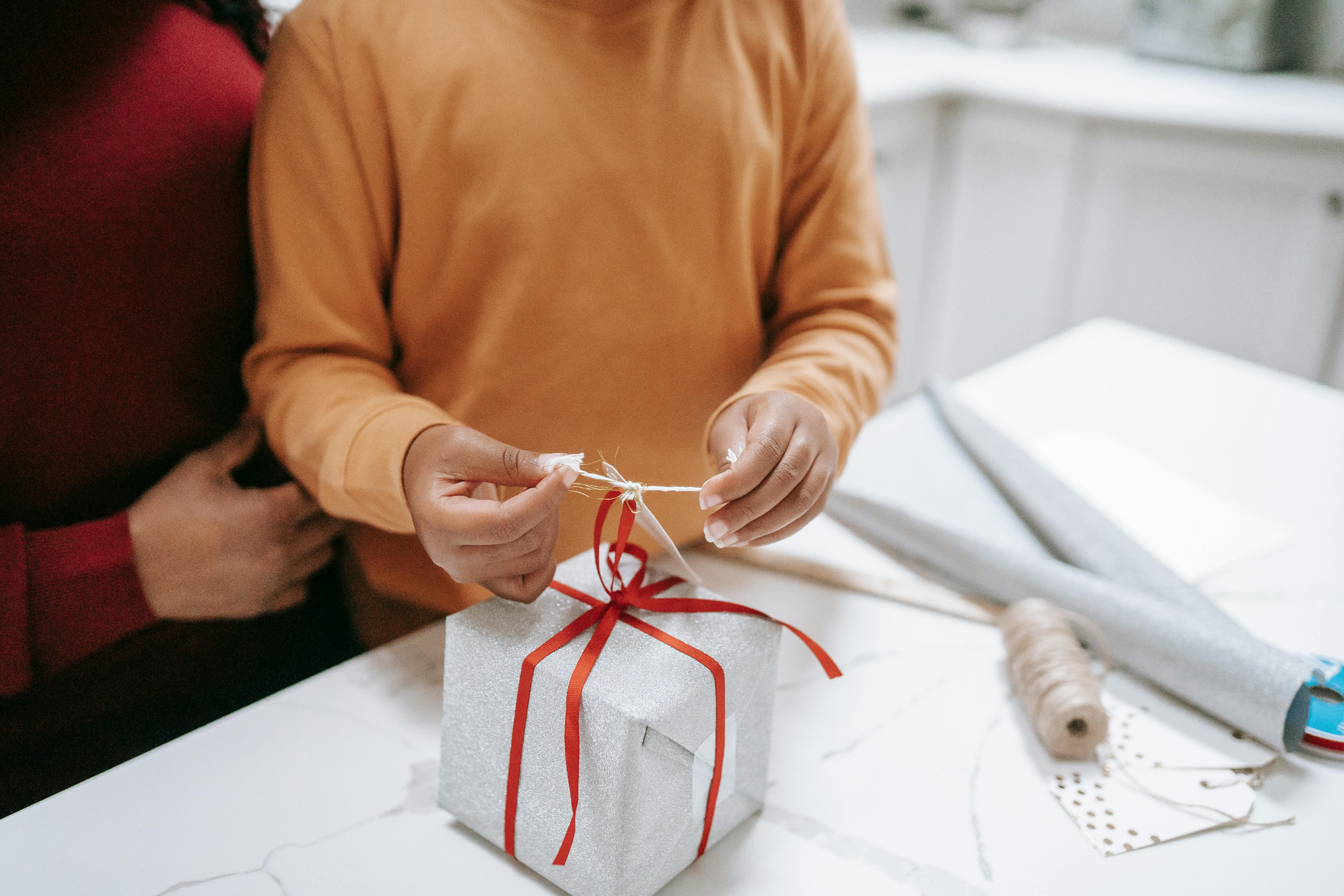 Couple opening a voucher for household support with food and energy costs